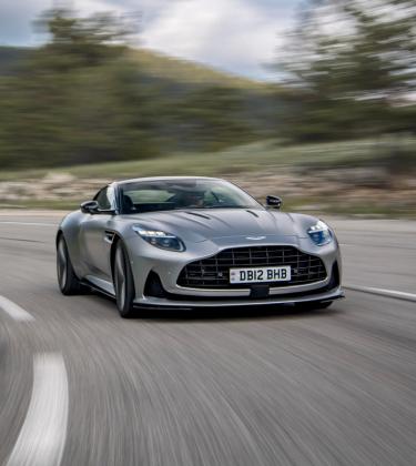 Silver Aston Martin DB12 driving on the road