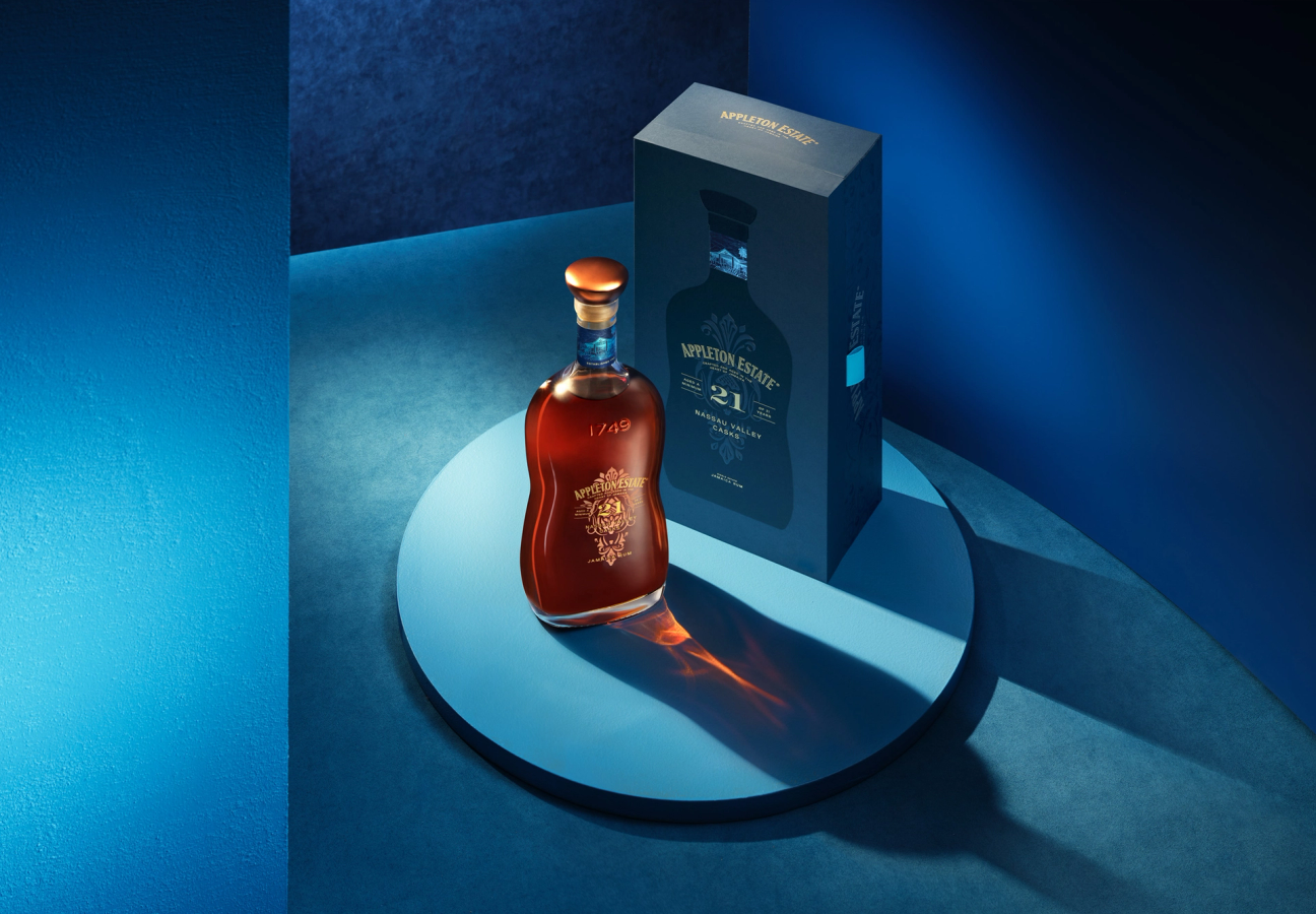 Appleton Estate 21 Nassau Valley Casks rum bottle and box in a blue setting