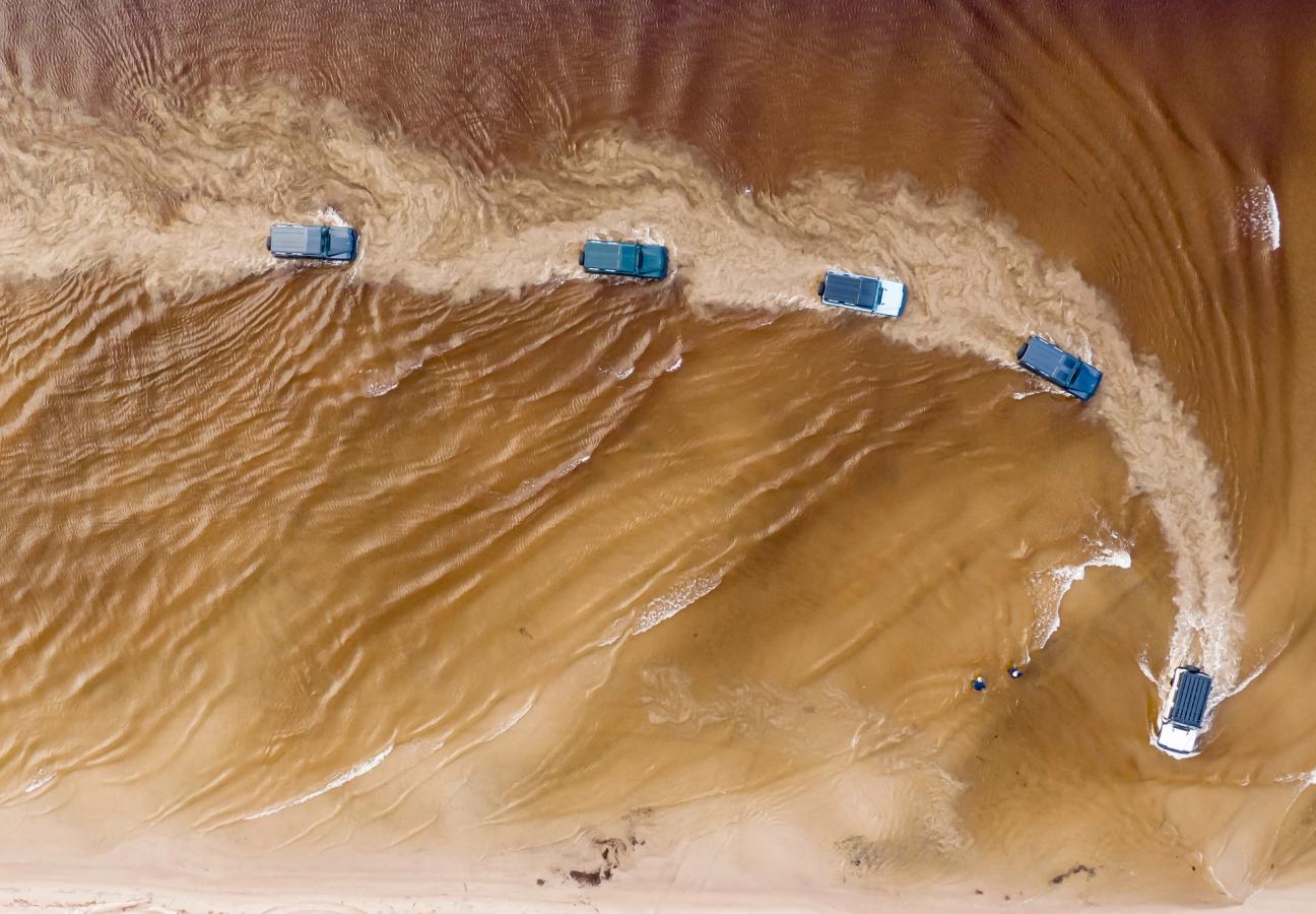 Ineos Grenadiers driving through water