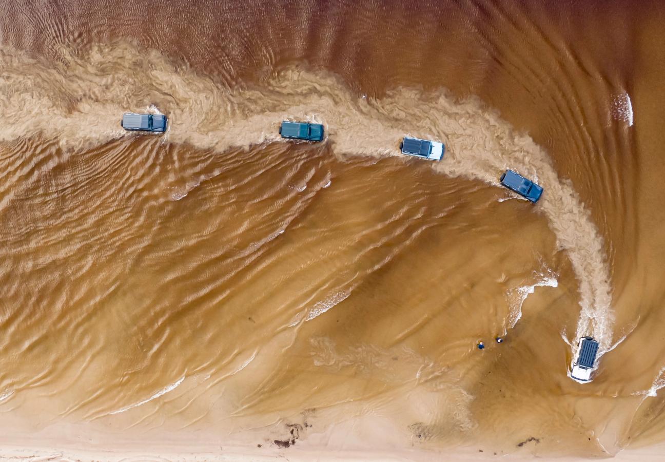 Ineos Grenadiers driving through water