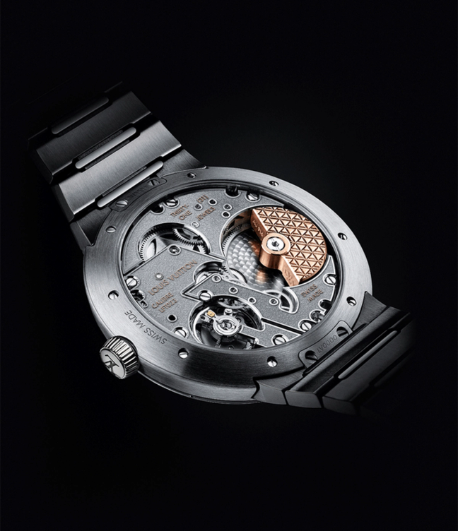 Mechanics and back of the Louis Vuitton Tambour Automatic 40mm Steel watch on a black back drop