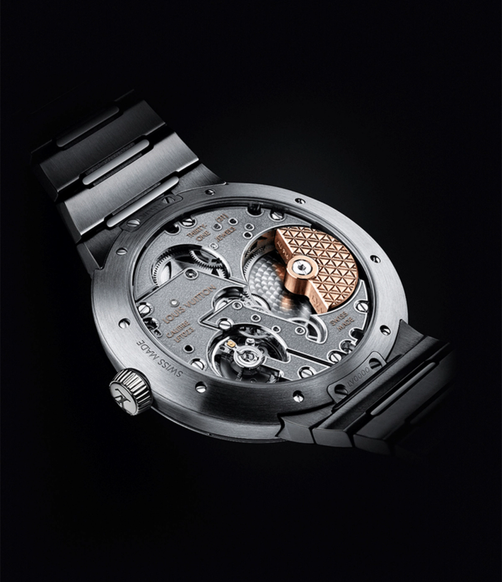Mechanics and back of the Louis Vuitton Tambour Automatic 40mm Steel watch on a black back drop
