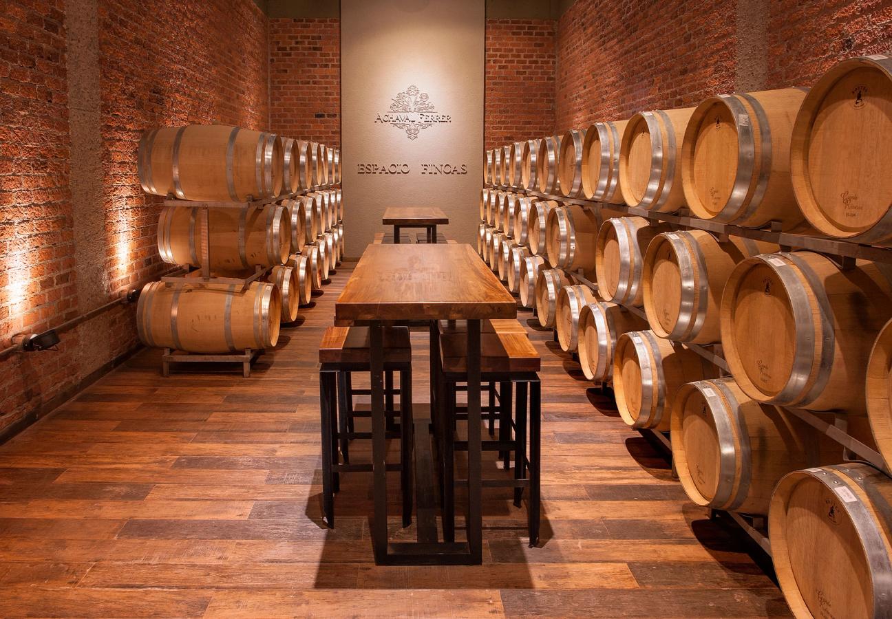 A cellar with walls lined with wine barrels