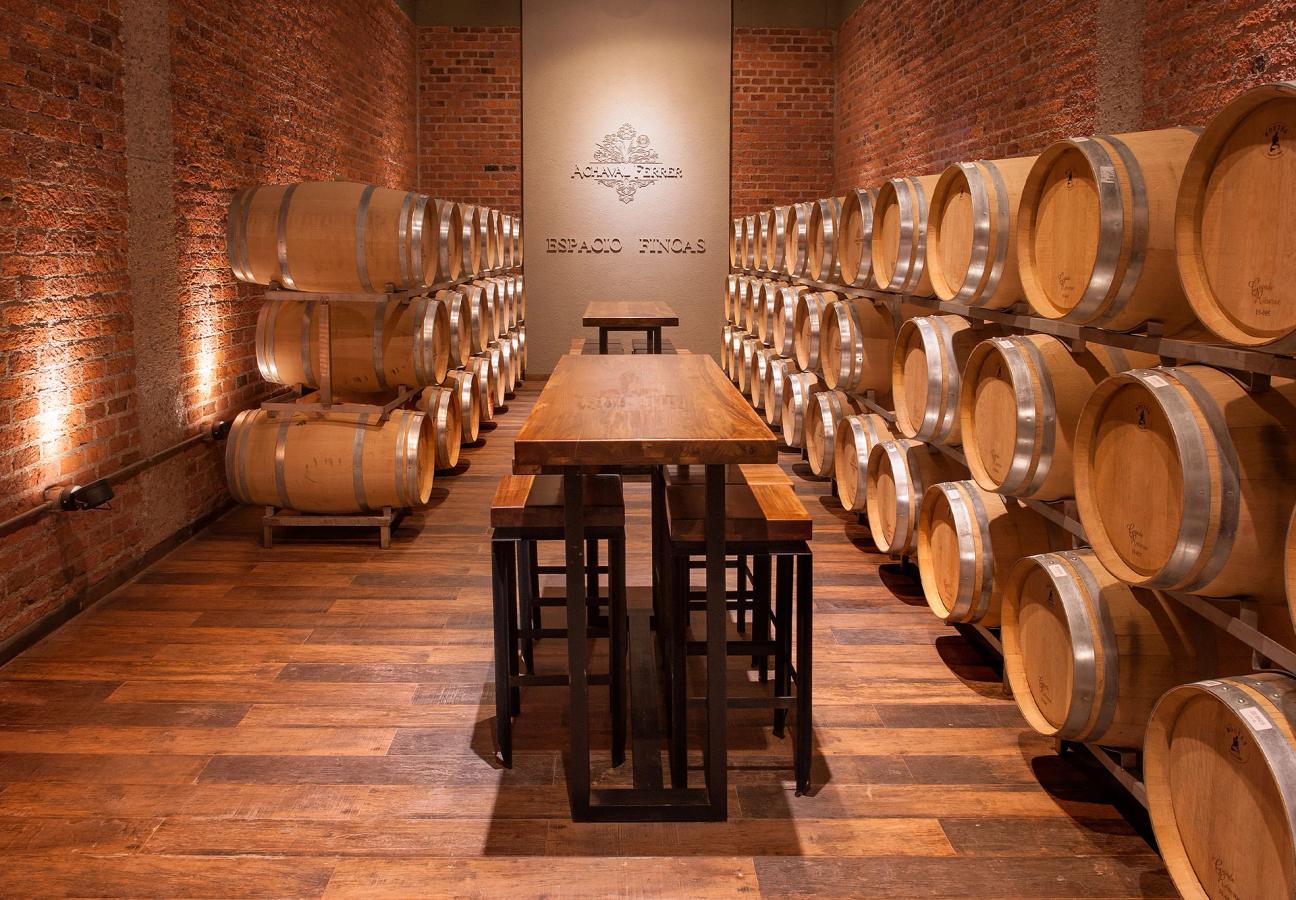 A cellar with walls lined with wine barrels