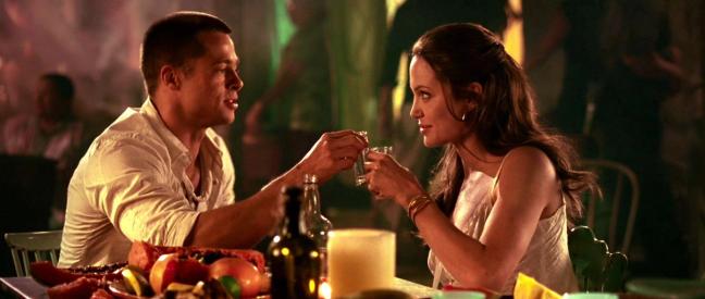 Angelina Jolie and Brad Pitt at a dinner scene