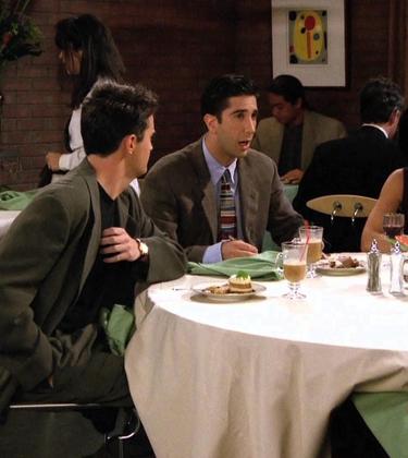 Characters from Friends discussing the bill at a restaurant