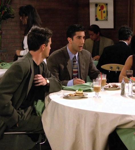 Characters from Friends discussing the bill at a restaurant