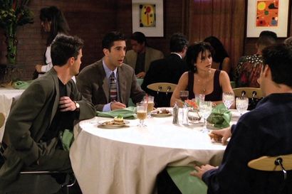 Characters from Friends discussing the bill at a restaurant