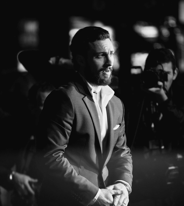 Black and White photo of Aaron Taylor-Johnson on red carpet