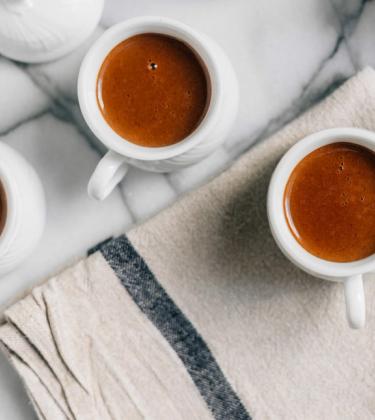 overhead shot of espresso coffees on marble table