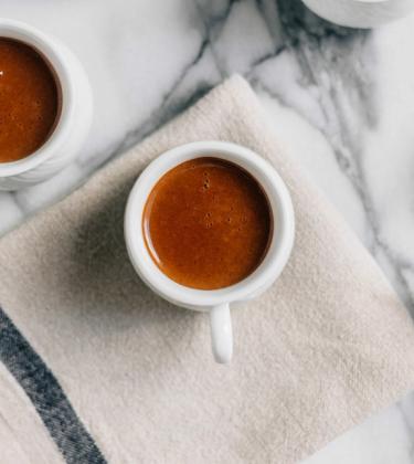 overhead shot of espresso coffees on marble table