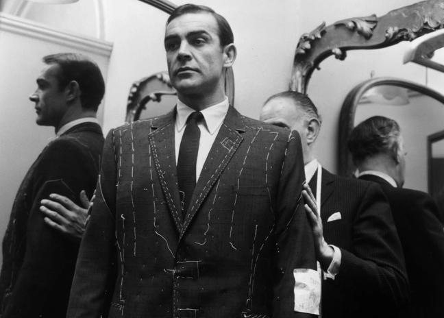 Sean Connery getting properly suited by Anthony Sinclair in London. (Photo by Harry Myers / Rex Features)