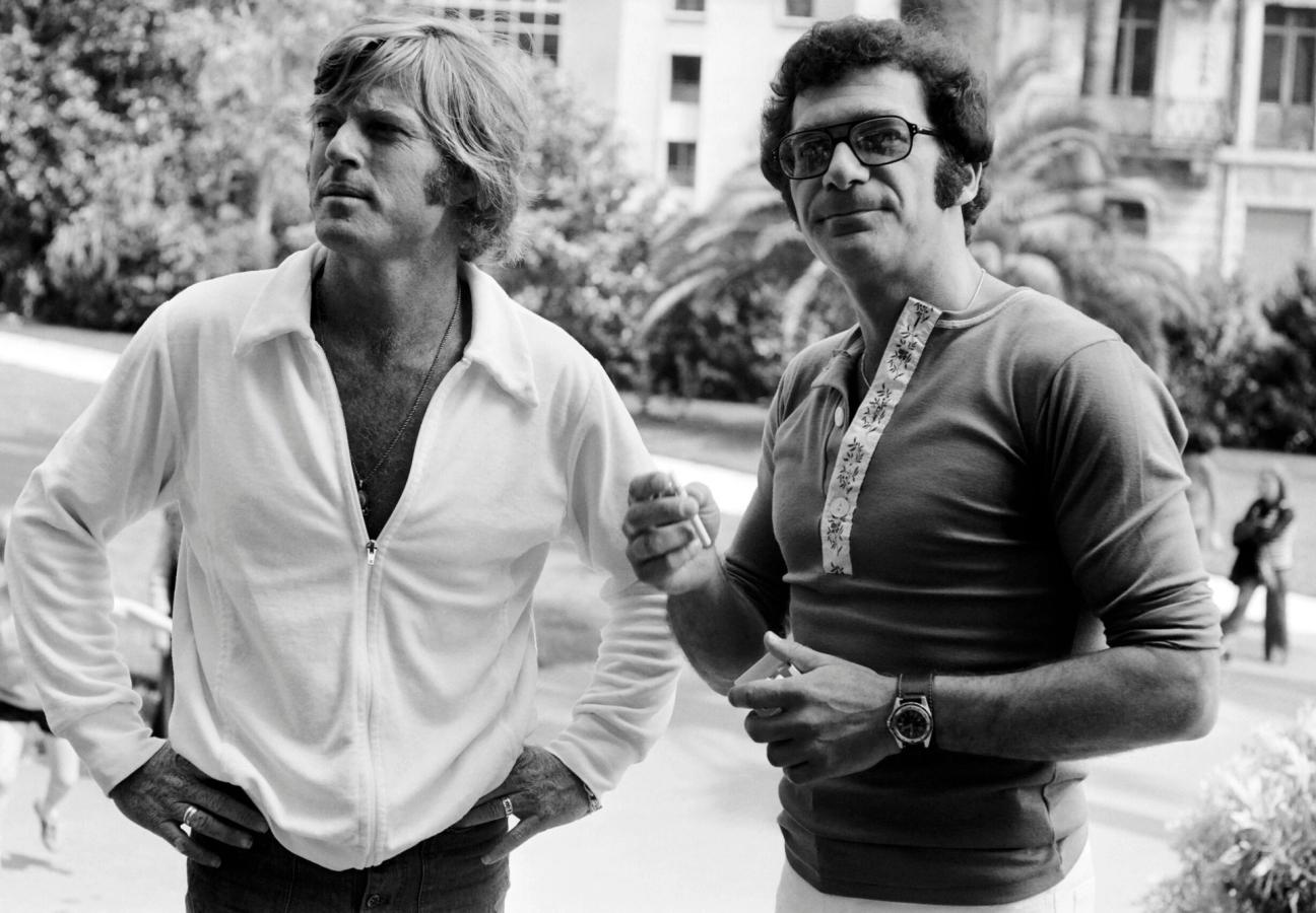 Photo taken in May 1972 shows (from L to R) US actor Robert Redford and director Sydney Pollack during the International Film Festival in Cannes. (Photo by - / AFP) (Photo credit should read -/AFP via Getty Images)