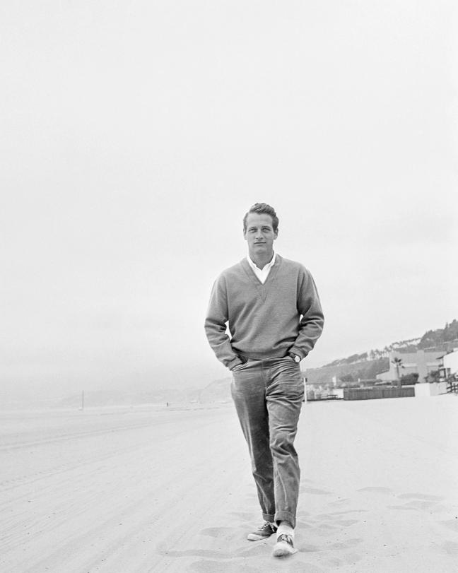 Paul Newman Walking along a beach