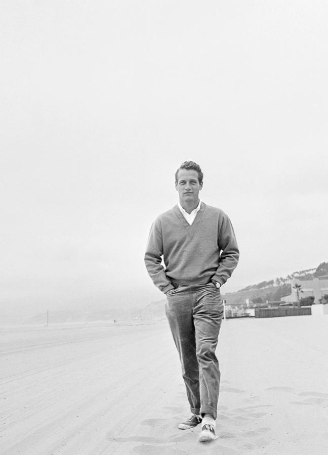 Paul Newman Walking along a beach