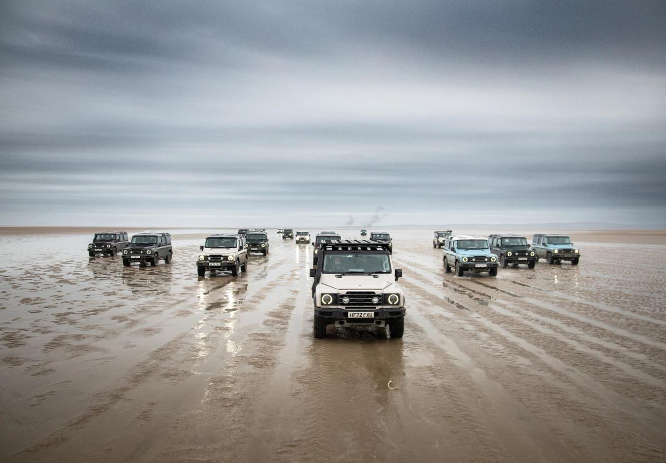 Ineos Grenadiers driving over wet sand terrain