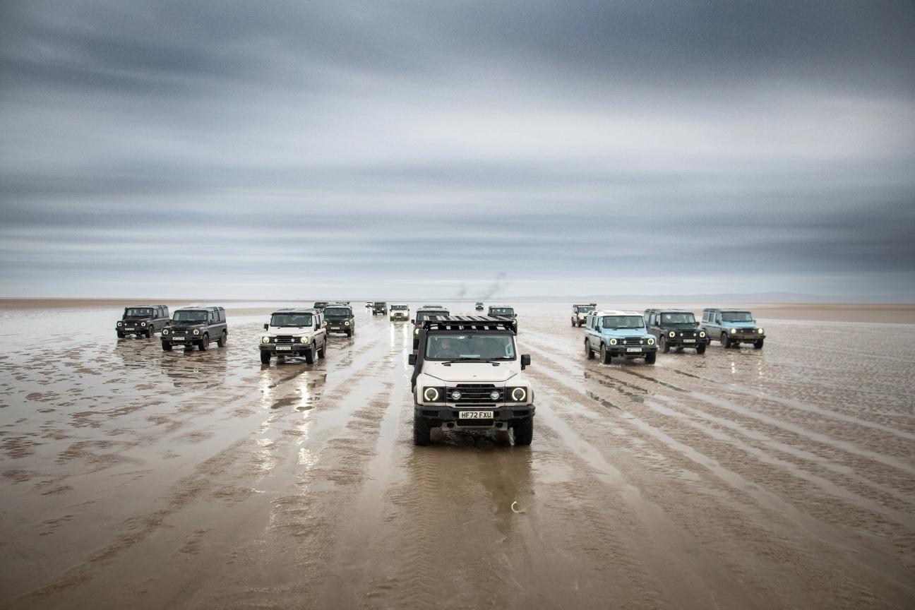 Ineos Grenadiers driving over wet sand terrain