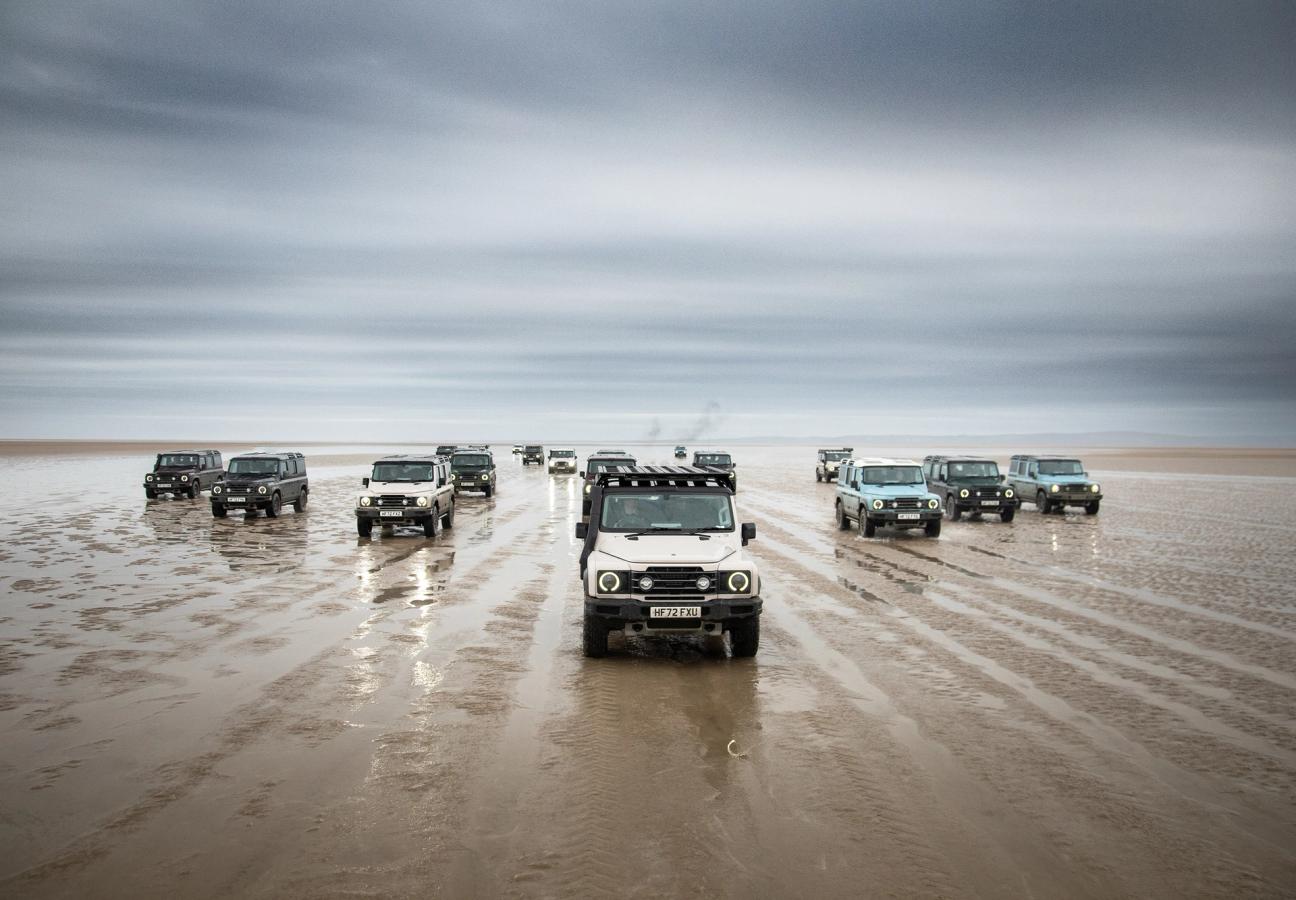 Ineos Grenadiers driving over wet sand terrain