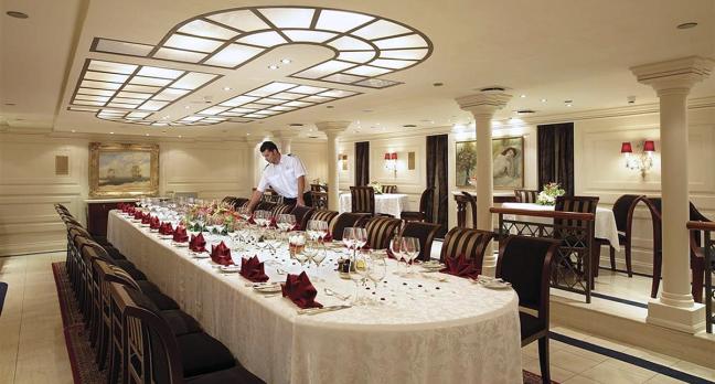 inside the Christina O super yacht showing the grand dining room