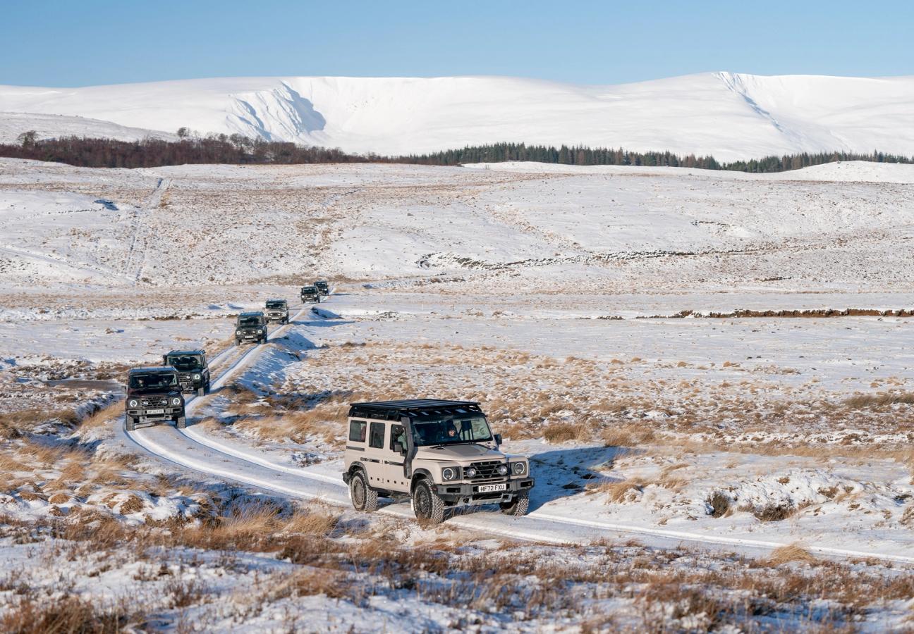 Ineos Grenadiers driving over snowy terrain 