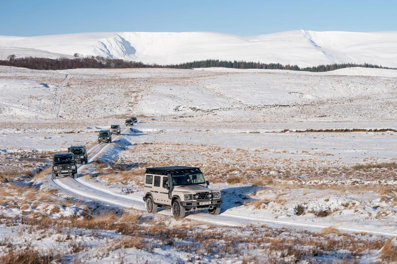 Ineos Grenadiers driving over snowy terrain 