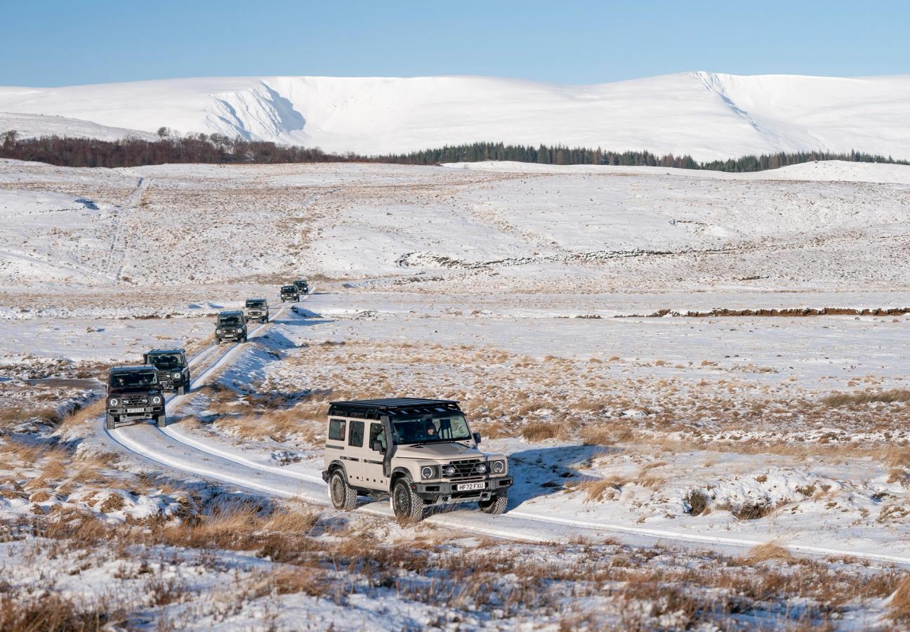Ineos Grenadiers driving over snowy terrain