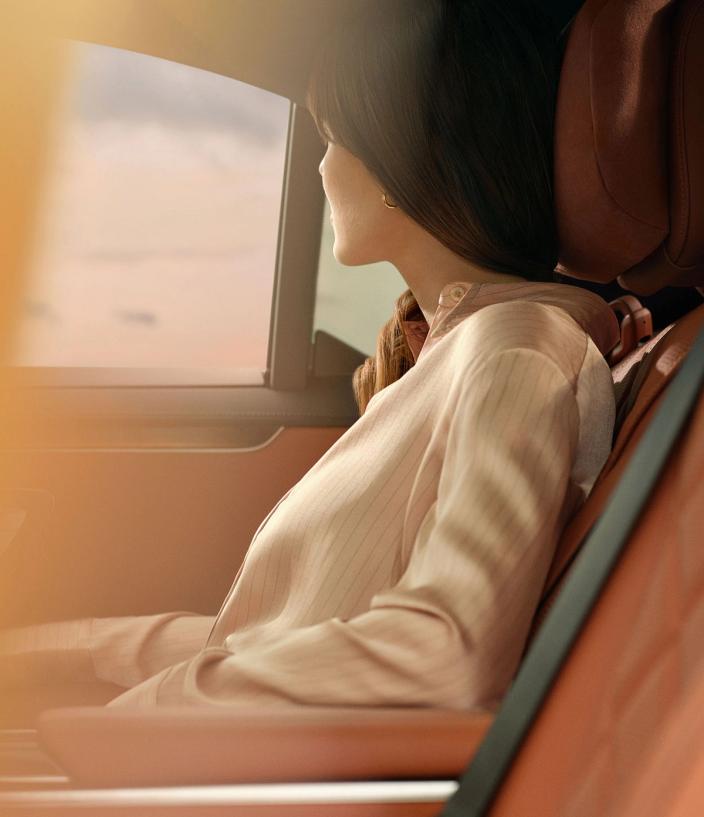 Woman in passenger seat of a Wheely car