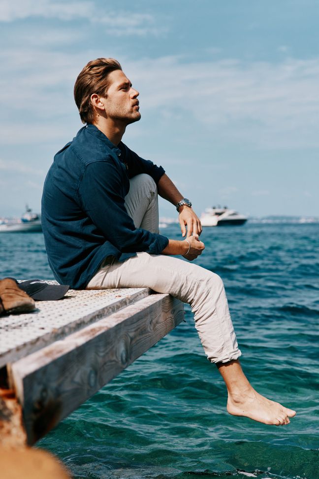 Ben Dahlhaus sat on the dock of the bay over the water