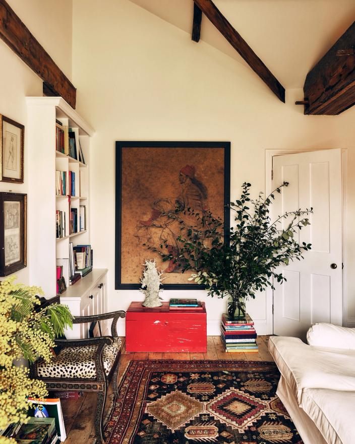 Exposed beams, pictures and antique furniture in Jamie Sharp’s home