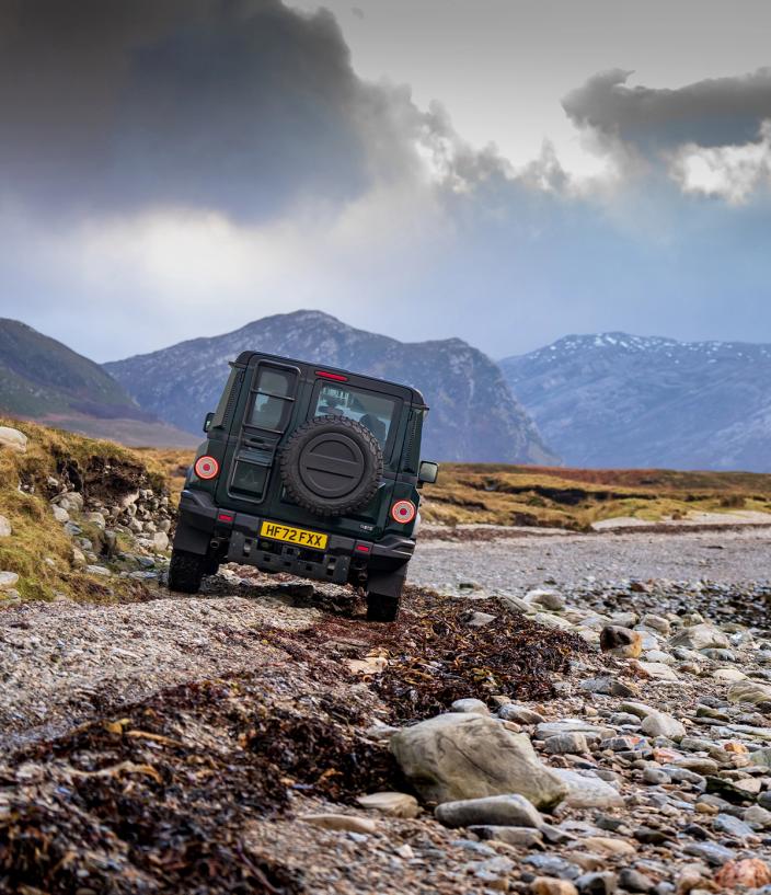 Ineos Grenadier driving over rubble and rocky terrain 