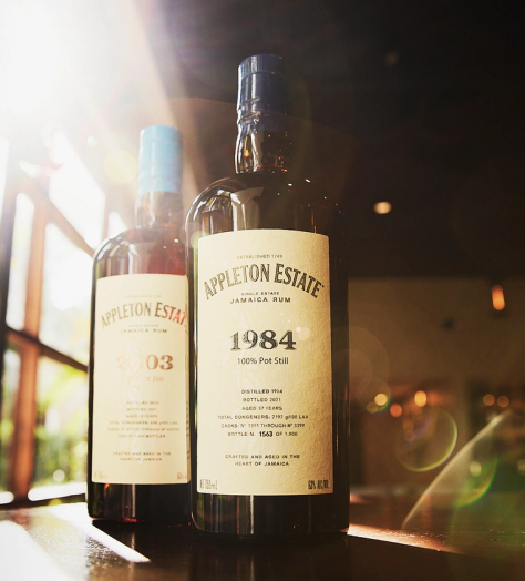 Appleton Estate 1984 and 2003 pot still rum bottles on a table