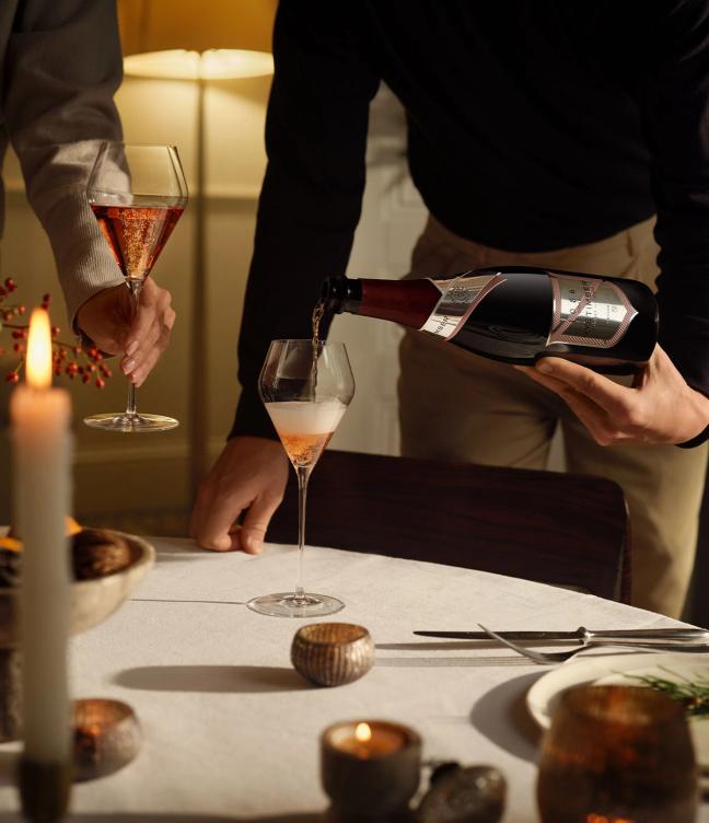 Bottle of 1086 Rosé by Nyetimber being poured into glasses