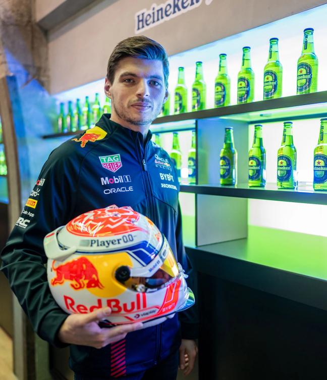 Max Verstappen with shelves of Heineken 0.0 bottles