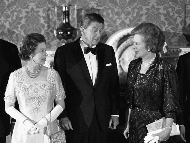 1984 - Elizabeth, Margaret Thatcher and Ronald Reagan at a banquet following the London Economic Summit. (Press Association)