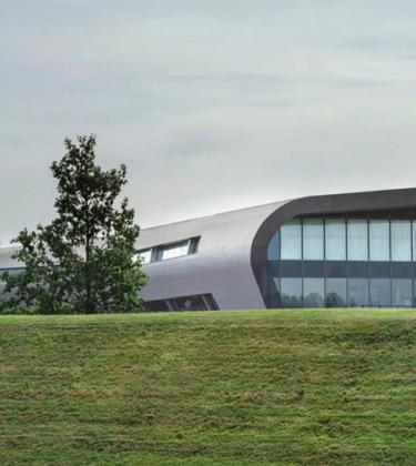 Exterior smooth curvy architecture of Farnborough Airport