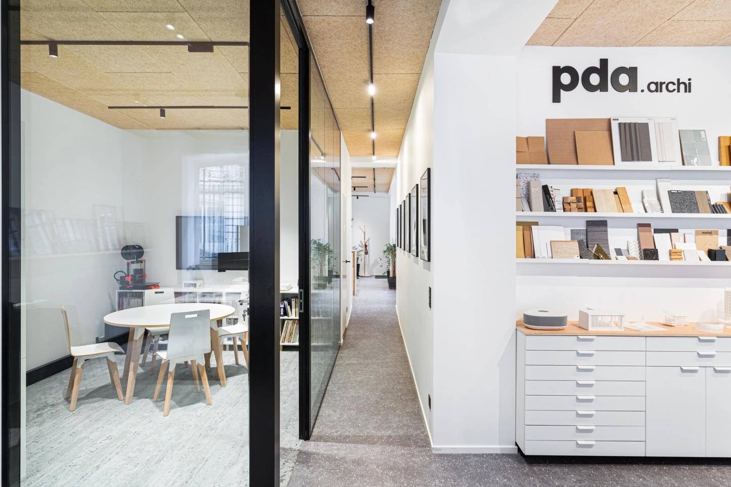 Photo of the glazed meeting room and material library of the PDA office on rue du Conservatoire, Paris 9th