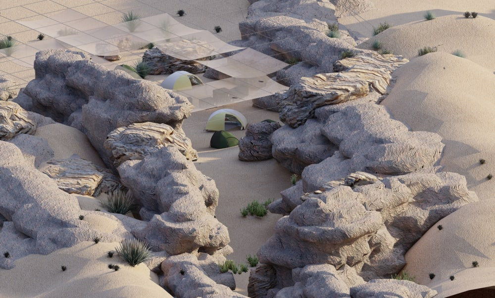 Aerial view of a desert-like landscape of rocks and sand, with some dome tents and a grid of wires above, some holding horizontal squares of transparent material.