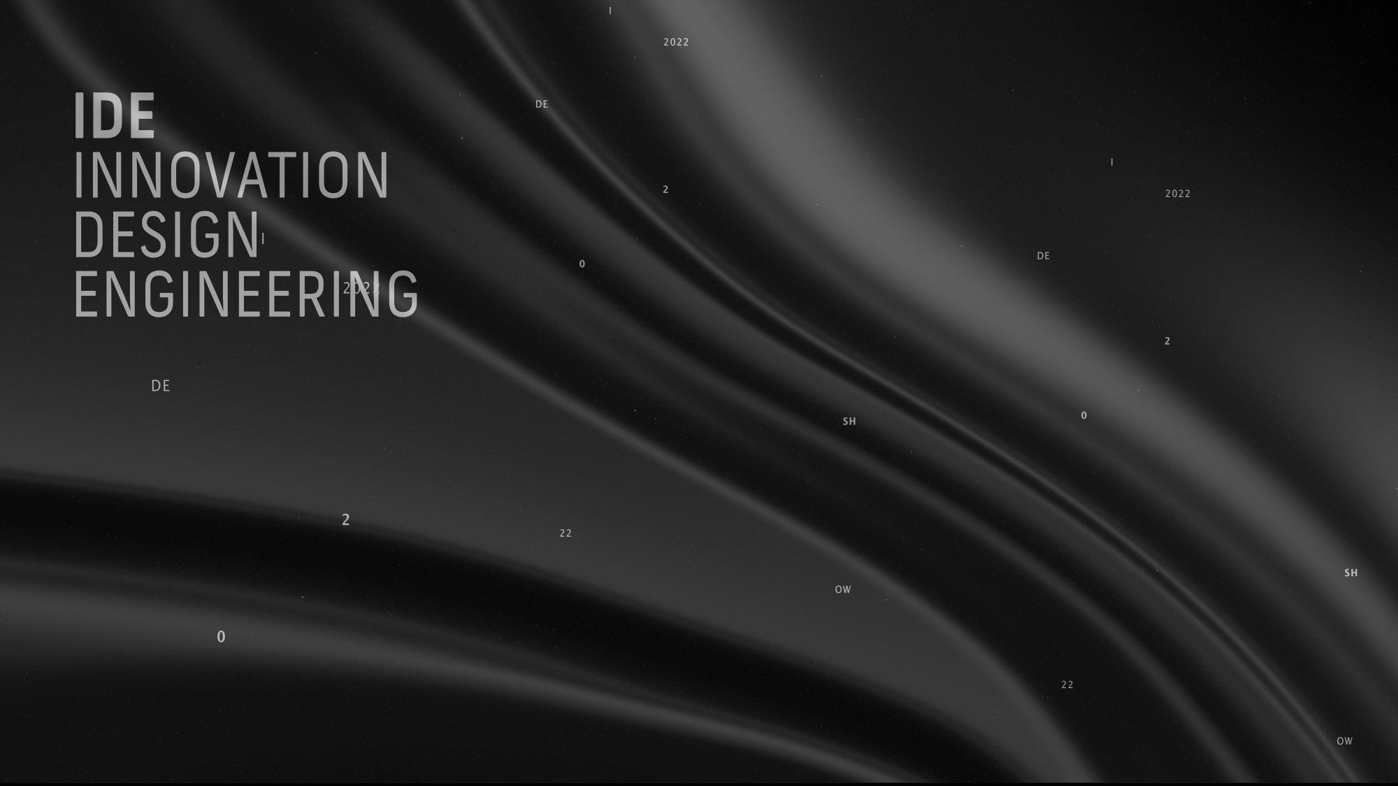 Image of text reading 'I D E Innovation Design Engineering' and tiny text dotted all over, including the number '22' and the letters 'D E', on a black and charcoal coloured rippled background.