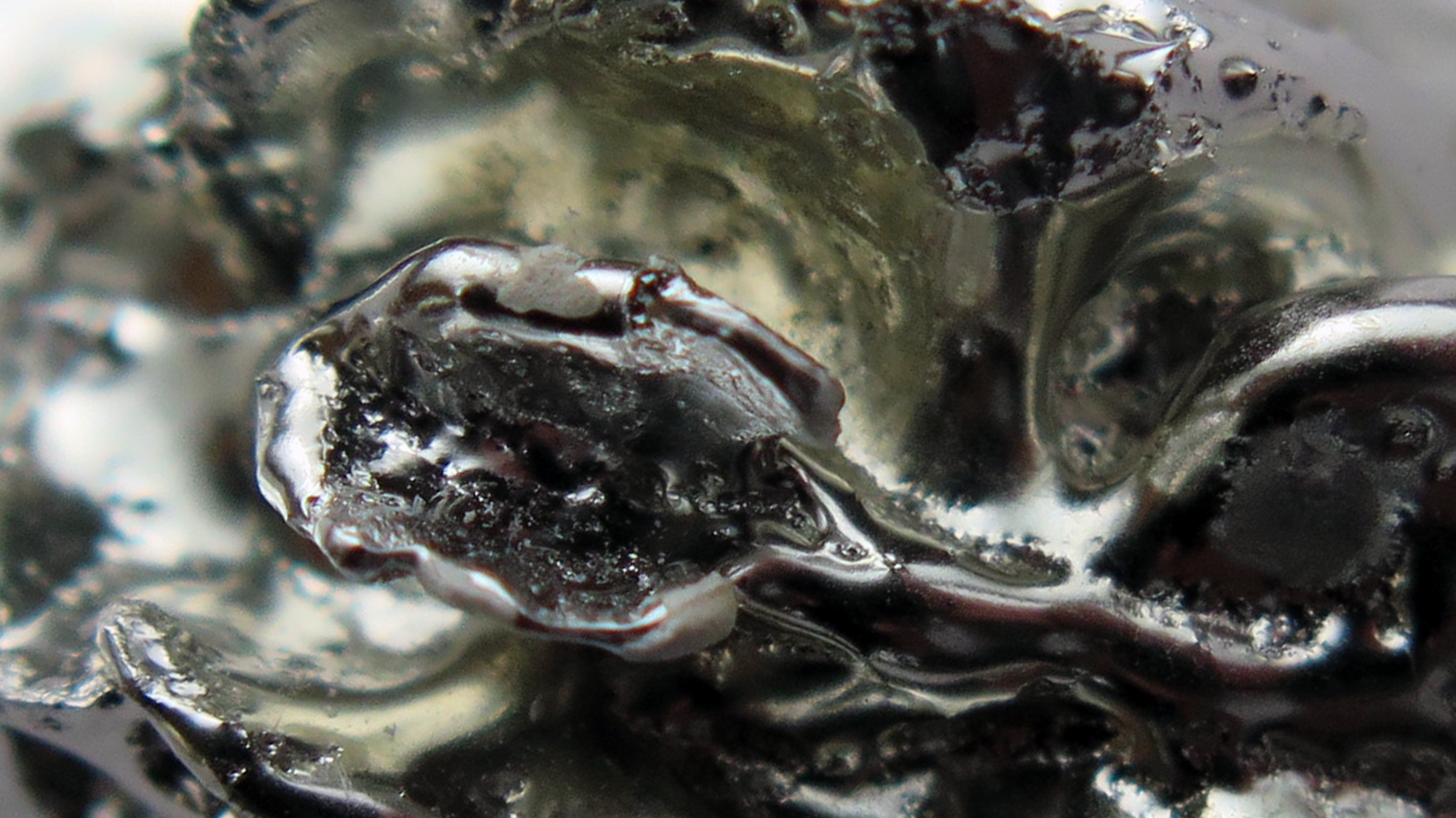 Rock or glass that looks like rolling black water surf.