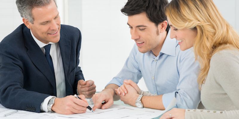 Clients discussing VA Loan with mortgage specialist.