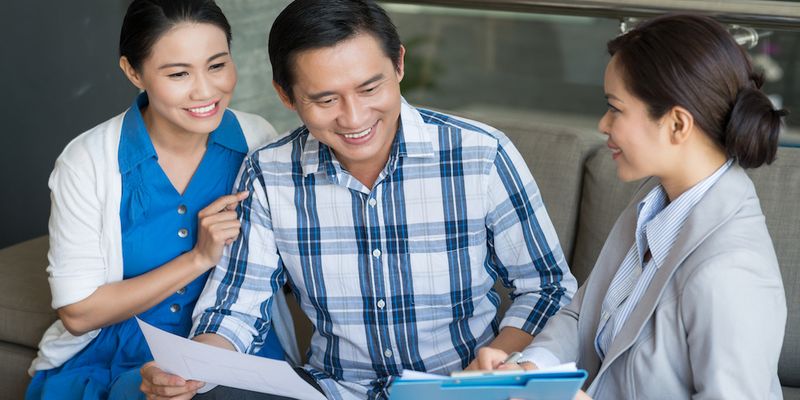 Couple checking their rent report.
