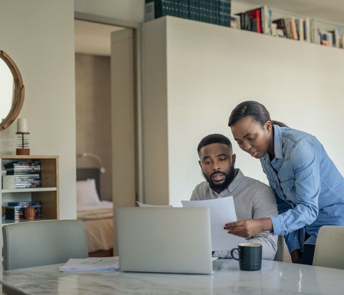 Couple discussing mortgage repayment options.