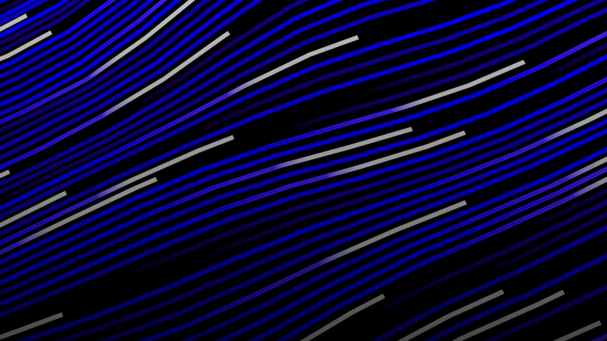 Abstract flowing lines of purple and white on black