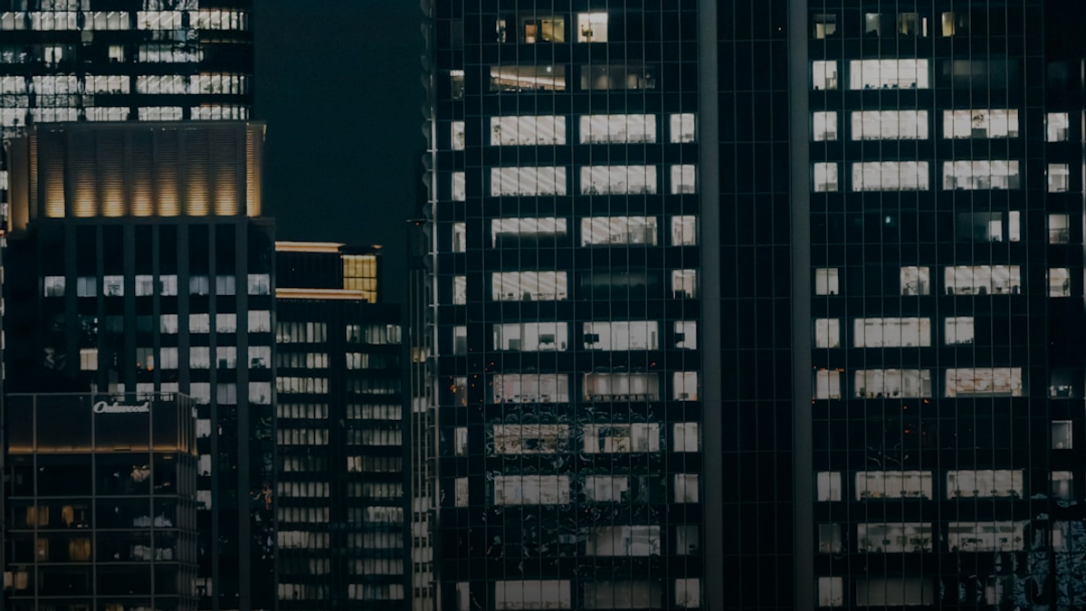 Skyscrapers with illuminated windows at night