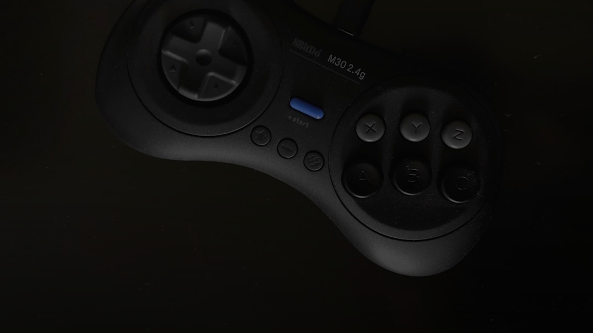 gray and black SEGA Genesis controller