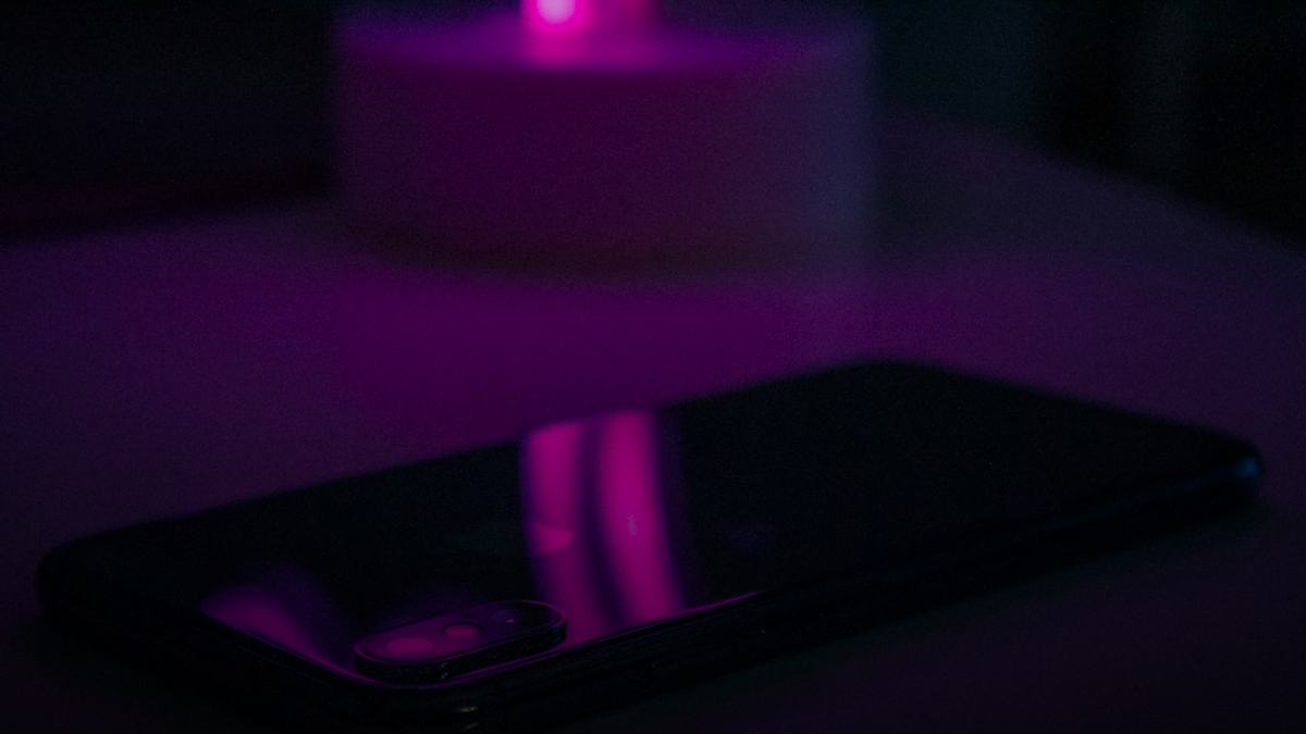 space gray iPhone X on white surface