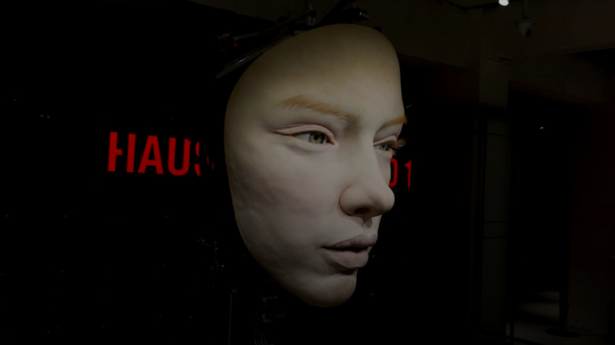 a white mannequin's head in a dark room