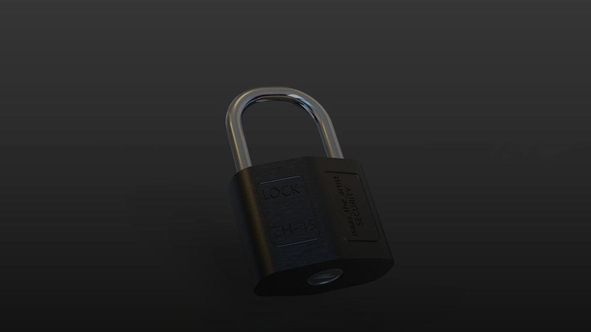 a closed padlock on a black surface