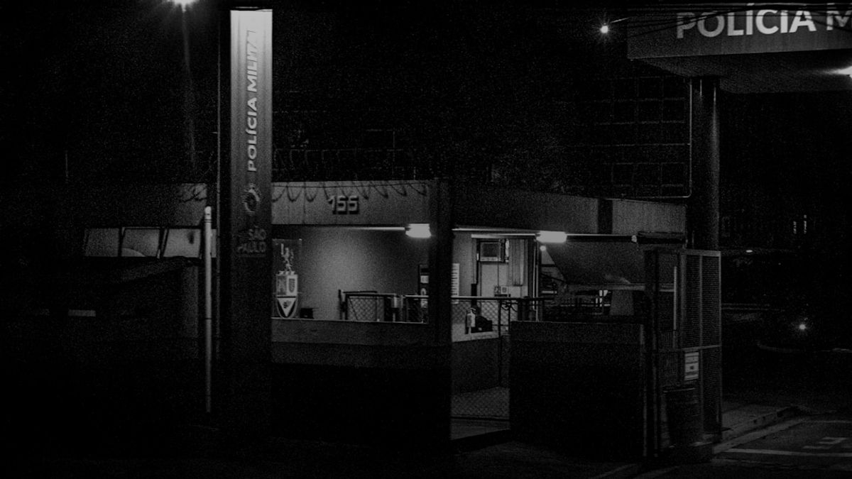 Police station entrance at night with lights on