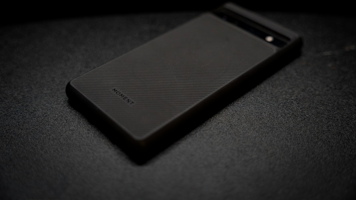 a close up of a cell phone on a table